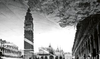 architecture of St Mark's Square, Venice upside down shot in the reflection of a puddle