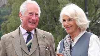 Prince Charles, Prince of Wales and Camilla, Duchess of Cornwall, known as the Duke and Duchess of Rothesay when in Scotland, smile as they visit local shops and businesses during a short walk through the village on August 31, 2021 in Ballater, Scotland.
