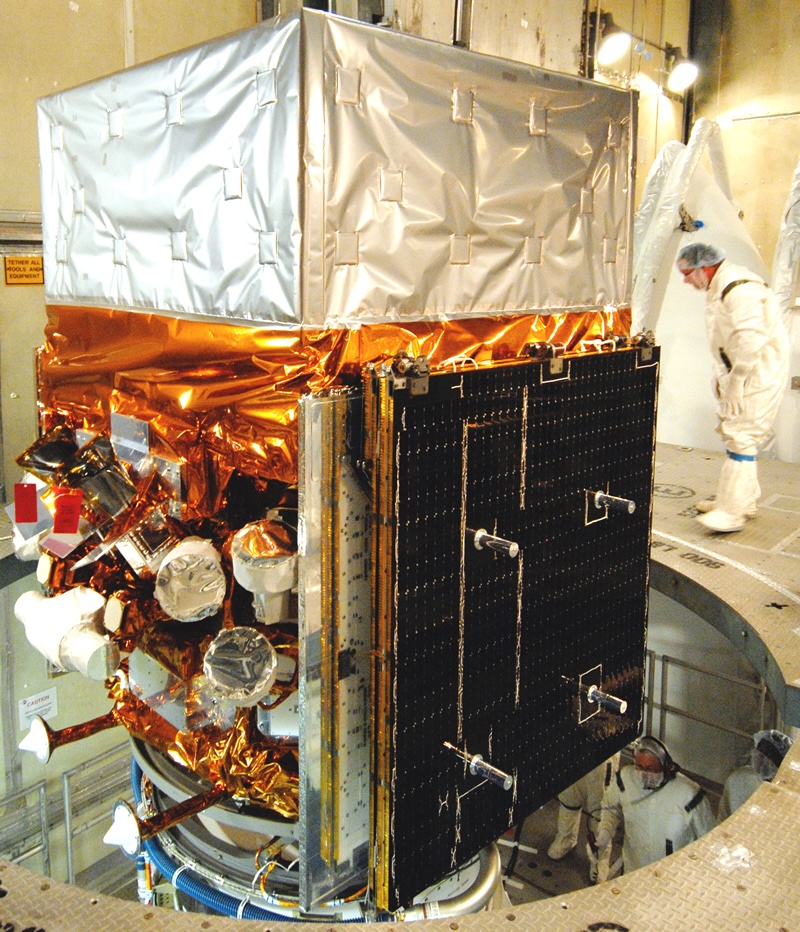 A photo of the Fermi spacecraft being assembled by laboratory workers