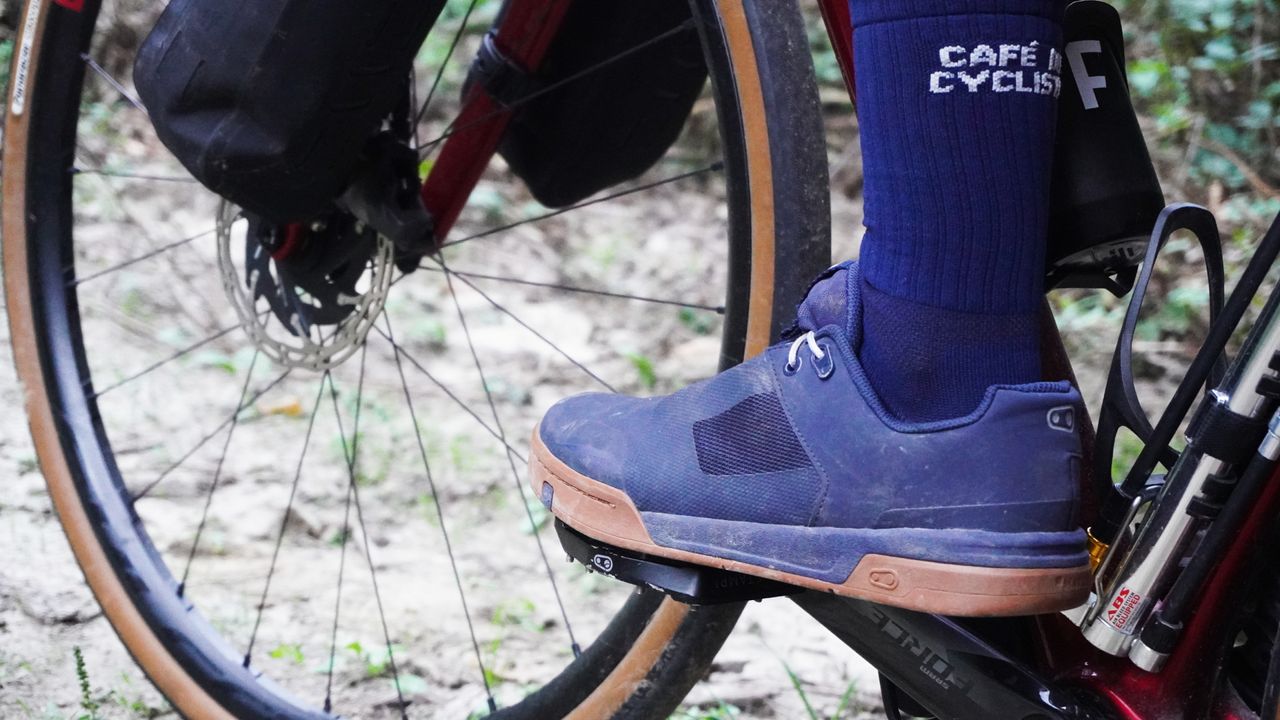 Image shows Anna riding Crankbrothers&#039; Stamp Lace flat shoes while on a gravel bikepacking trip.