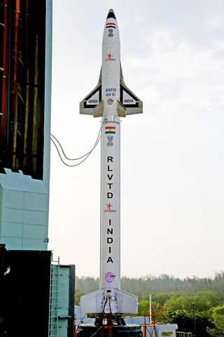 The Indian Space Research Organisation's first space plane prototype, called the Reusable Launch Vehicle-Technology Demonstrator, stands atop its HS9 solid rocket booster ahead of its debut launch - a successful test flight - on May 23, 2016 at the Satish