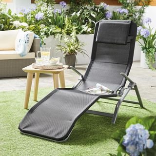 aldi sun lounger next to jar and glass on table