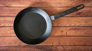 Carbon steel pan on wooden table