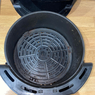 Before picture of air fryer basket. It is greasy and grimy