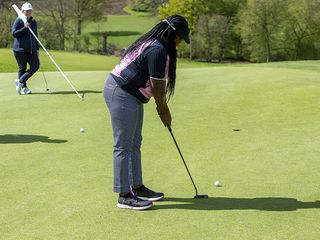 Genelle Aldred putting for birdie on the green at Brocket Hall Golf Club