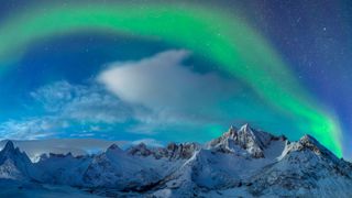 Snowcapped peaks and northern lights