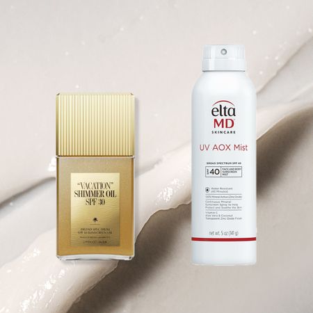 two bottles of sunscreen on top of a textured background