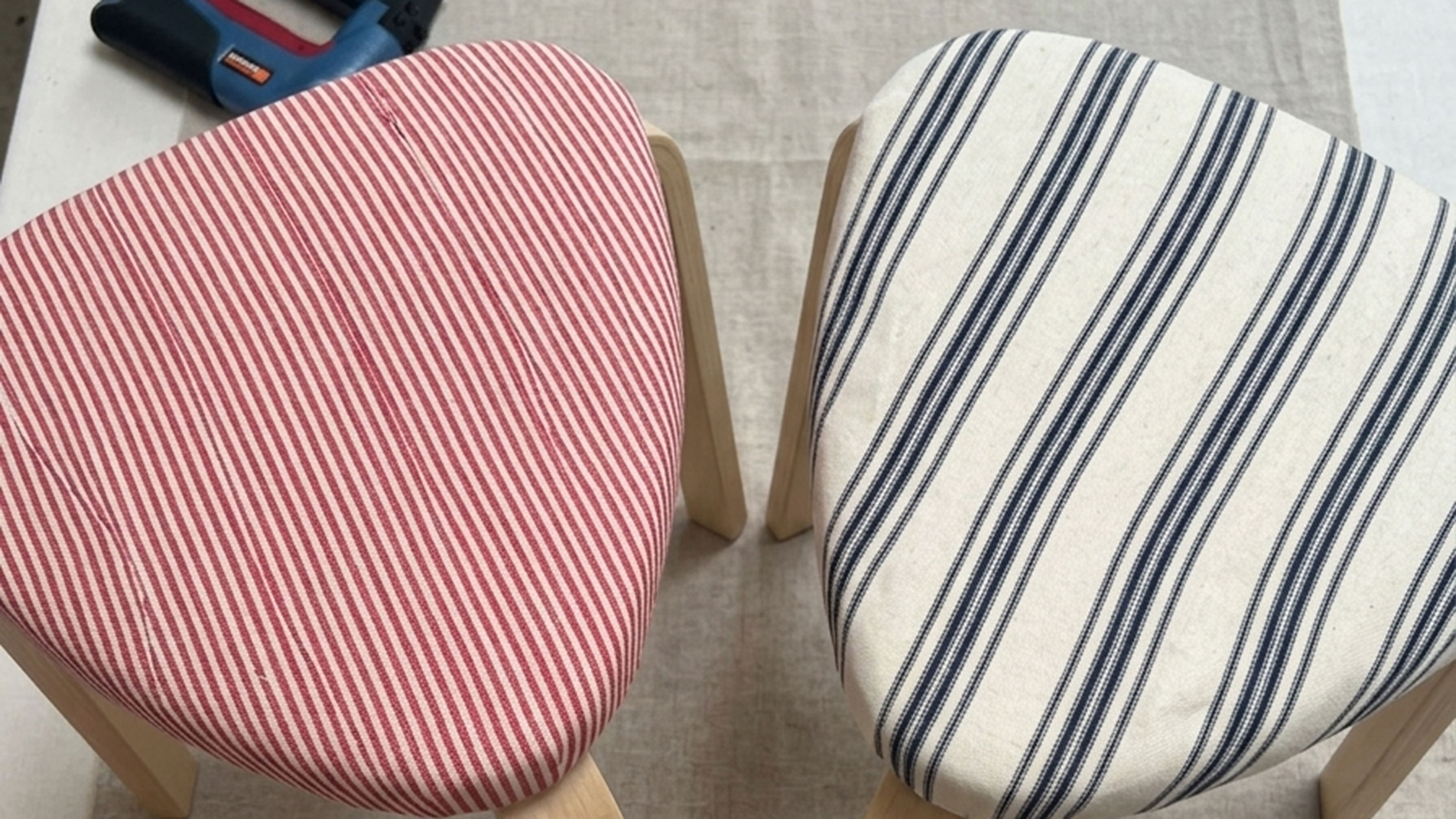 AI image of two stools upholstered with striped fabric