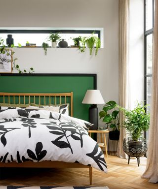 naturalist bedroom with blond parquet floor, printed bed linen on wood frame bed, slim window light and large crittall style windows - Habitat