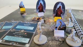 Close up of Gloomhaven: Jaws of the Lion pieces and cards