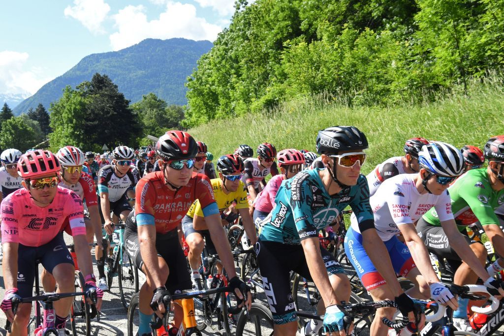 Riders take the start of the eighth stage of the 73rd edition of the Criterium du Dauphine cycling race a 147km between La LechereLesBains and Les Gets on June 6 2021 Photo by Alain JOCARD AFP Photo by ALAIN JOCARDAFP via Getty Images