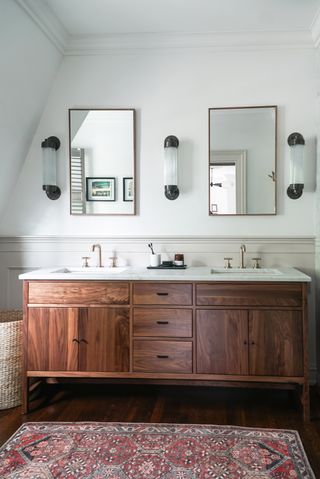bathroom with double wooden vanity two mirrors and a typrich of lighting 001 Davey Lighting - Pillar offset wall light - weathered brass off - 7216 BR WE - bathroom lighting