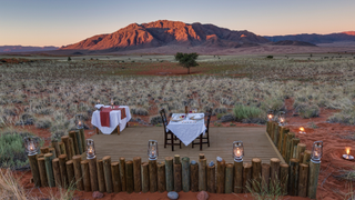 Dining table set up in the Namib desert at Wolwedans Dune Camp