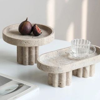 Two stone decorative stands