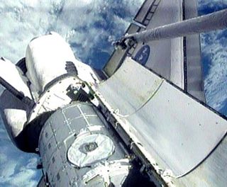 Astronauts Inspect Shuttle for Damage