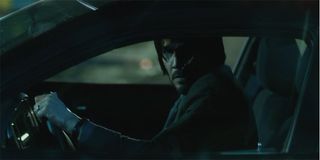 John Wick in his car