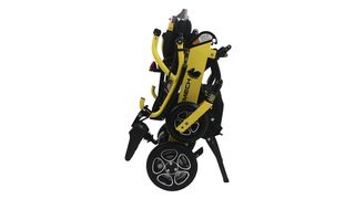 An image showing the ForceMech Voyager R2, designed in a black and yellow color scheme, folded up, ready to be placed in the trunk of a car
