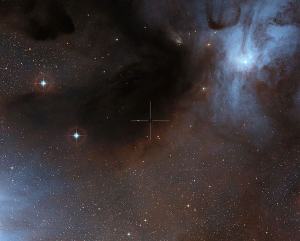 This image shows the brown dwarf ISO-Oph 102, or Rho-Oph 102, in the Rho Ophiuchi star-forming region. Its position is marked by the crosshairs. This visible-light view was created from images forming part of the Digitized Sky Survey 2. Image released Nov. 30, 2012.