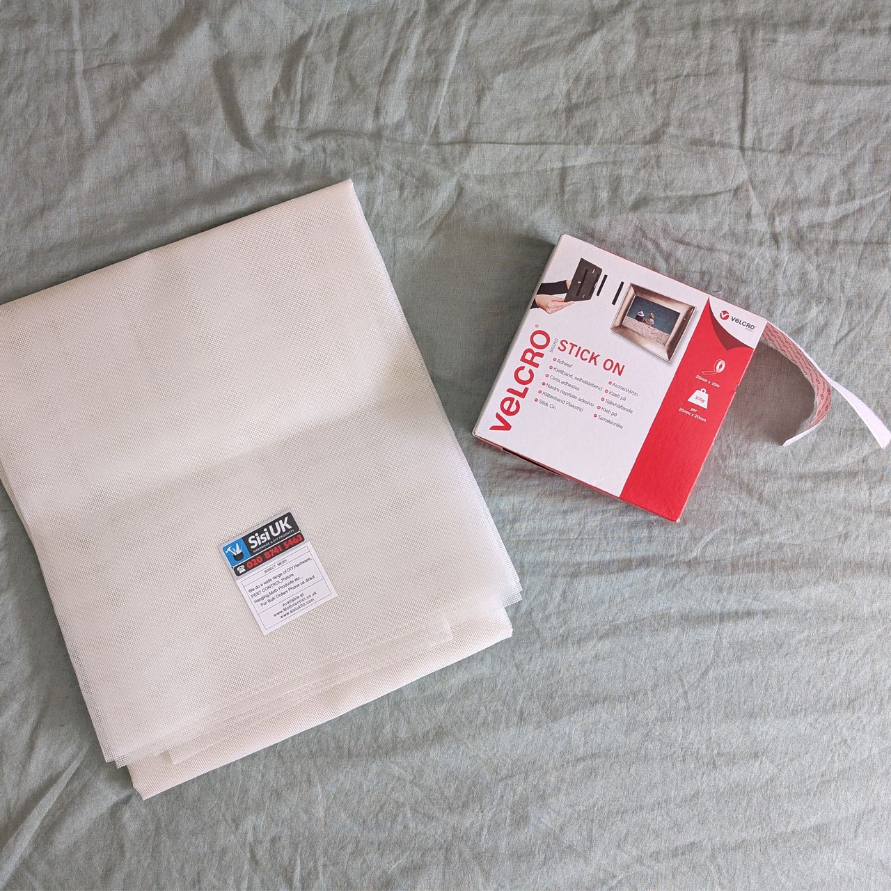 A DIY mosquito screen made with Velcro tape and fly mesh cut to size