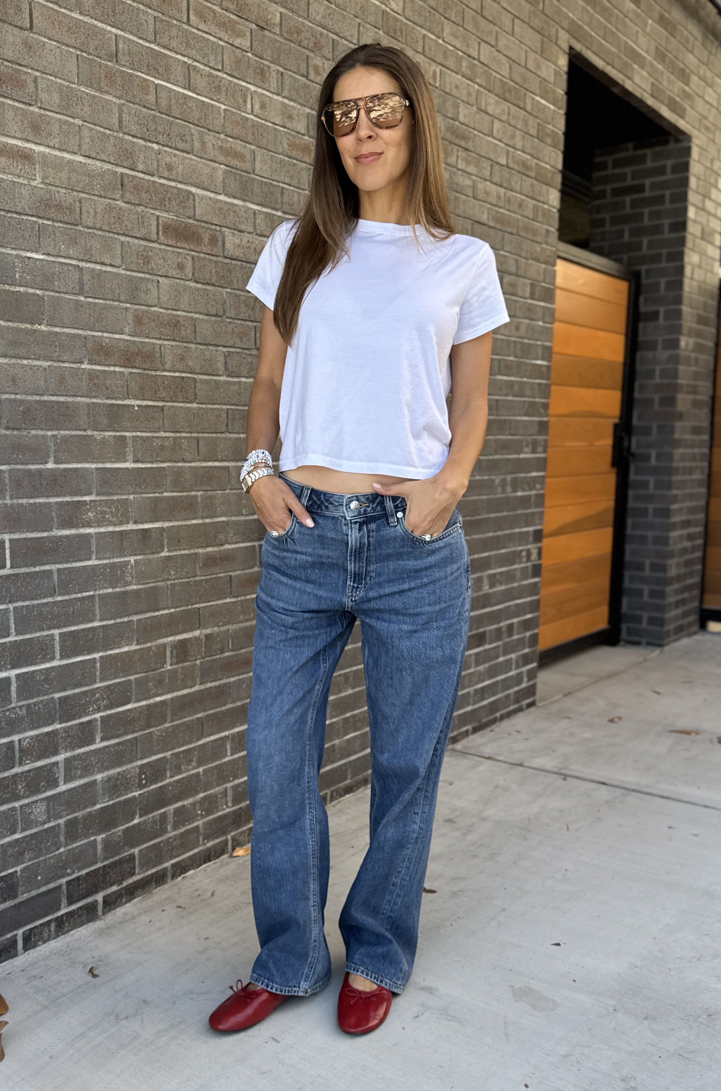 Judith Jones in a white tee and Calvin Klein jeans.