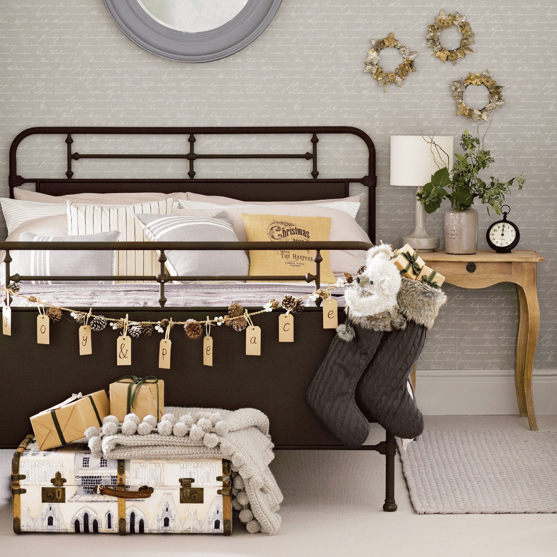 bedroom with grey brick designed wall brown bed with designed cushions