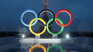 Olympic rings illuminate at place du Trocadero near the Eiffel Tower ahead of the Paris 2024 Olympic Games.