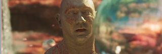 Drax looking at a sphere in Guardians of the Galaxy Vol. 2