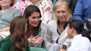Catherine, Duchess of Cambridge, Julia Lemigova, Martina Navratilova and Meghan, Duchess of Sussex in the Royal Box on Centre Court during day twelve of the Wimbledon Tennis Championships at All England Lawn Tennis and Croquet Club on July 13, 2019 in London, England.