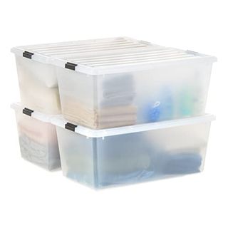 Four cloudy white plastic stackable storage bins, shown stacked two by two