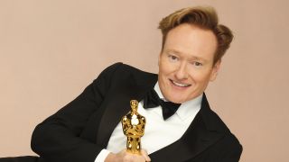 Conan O'Brien with an Academy Award trophy ahead of the 2025 Oscars, which he hosted.