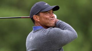 Tiger Woods takes a shot in the first round of The Open