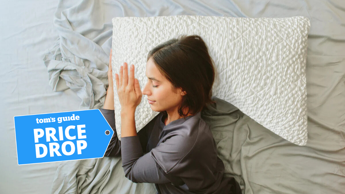 Woman sleeping on a white curved pillow