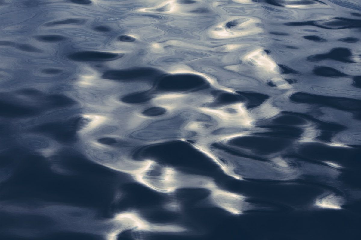 The surface of the ocean at Big Sur at dusk, in California.