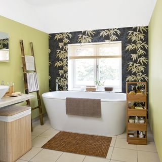 bathroom with bathtub and wallpaper on wall