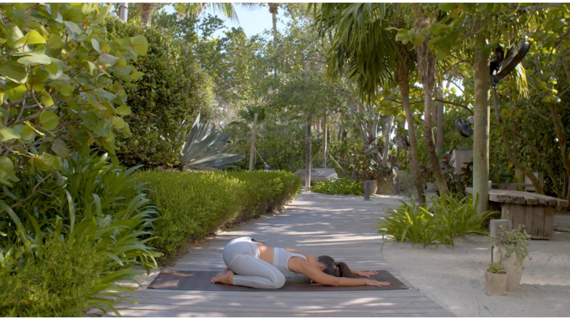 woman does yoga outdoors