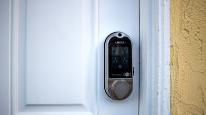 Lockly Vision smart lock installed on a white door