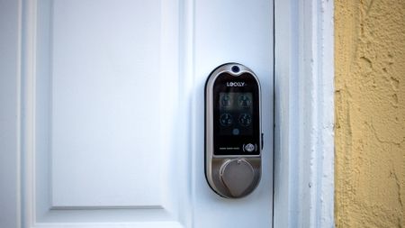 Lockly Vision smart lock installed on a white door