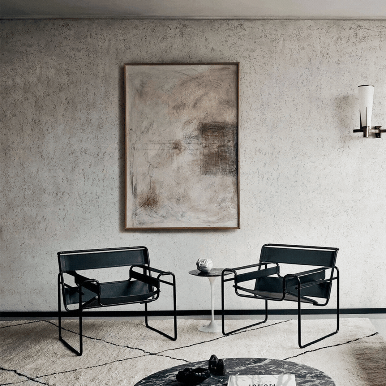 Knoll Wassily Lounge Chair in a rotating gif showcasing it in a minimalist, monochrome living room and as a product again pale gray background.