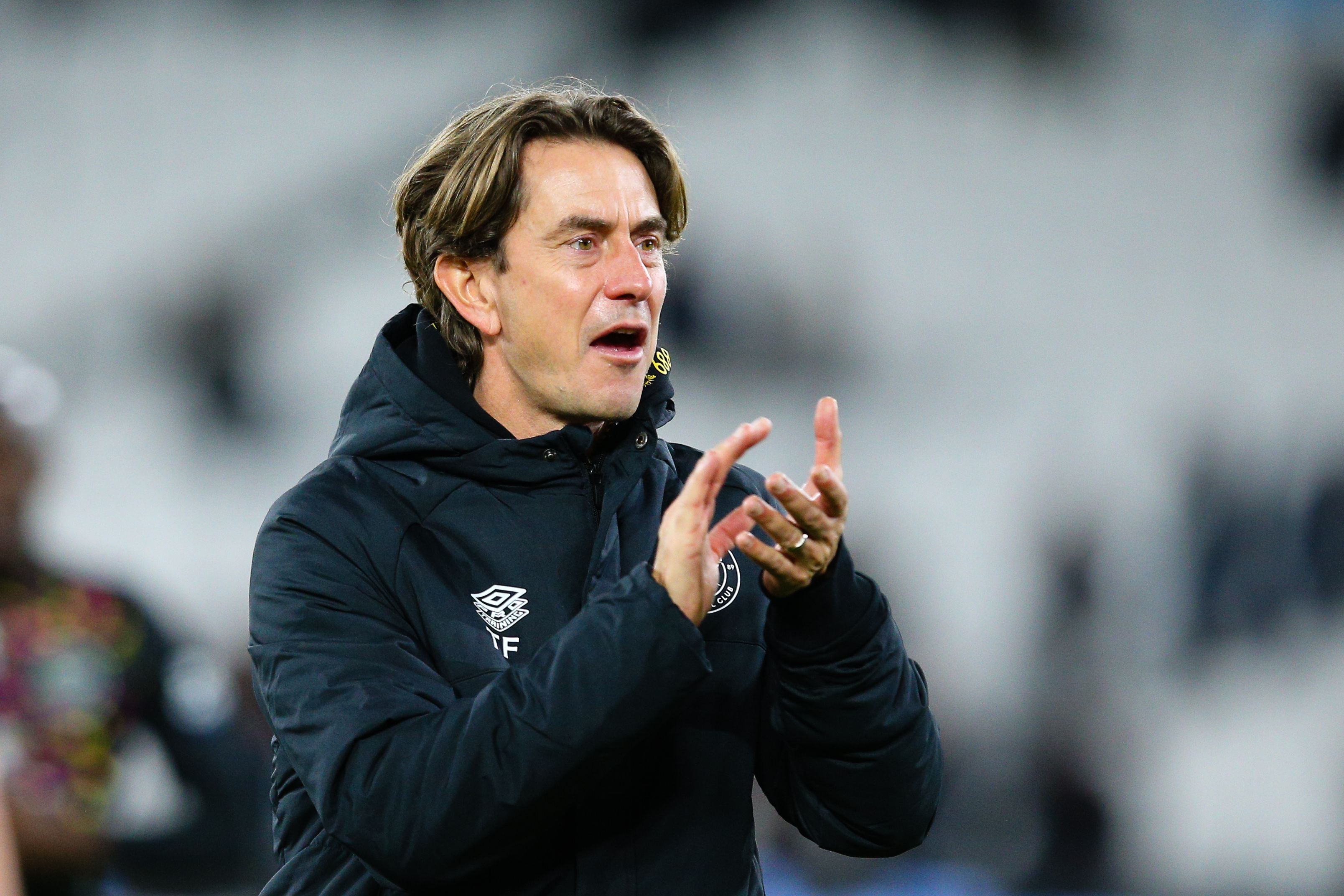 Thomas Frank applauds from the sidelines at Brentford