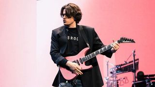 John Mayer playing a pink Jackson guitar live