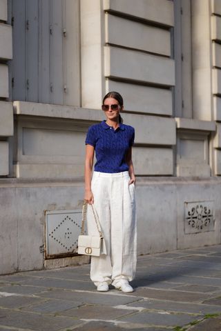 woman in linen pants and blue polo shirt