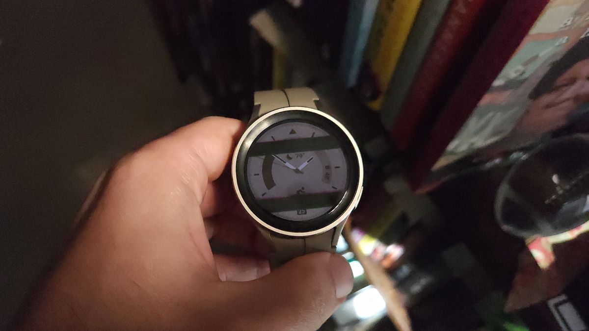 A photo of the Samsung Galaxy Watch 5 Pro showing thick black bars over the display, indicating that the display uses PWM dimming.
