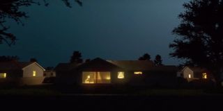 Lit up house in the dark from I'll Be Gone in the Dark