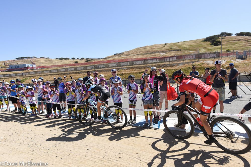 Lea Davision (Specialized) chases Rebecca Henderson in front of the Little Bella cheering squad