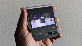 Samsung Galaxy Z Flip 5 cover screen with a YouTube video