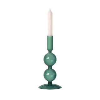 A round green glass candle taper holder