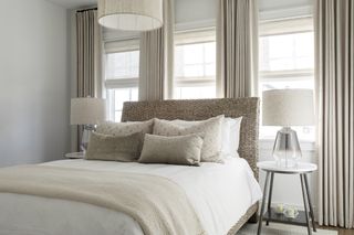 small bedroom in neutral palette by Brad Ramsey