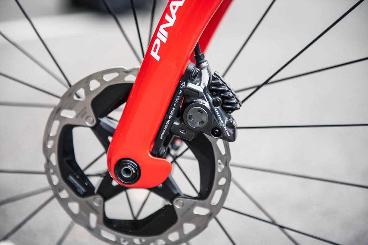 A close up of Michal Kwiatkowski's Pinarello Dogma F showing the new Dura-Ace disc brake and rotor
