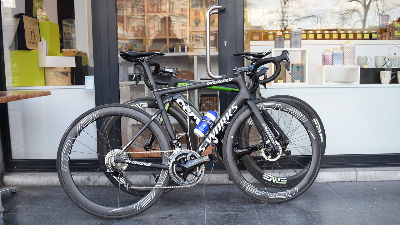 The bikes are locked up outside the cafe