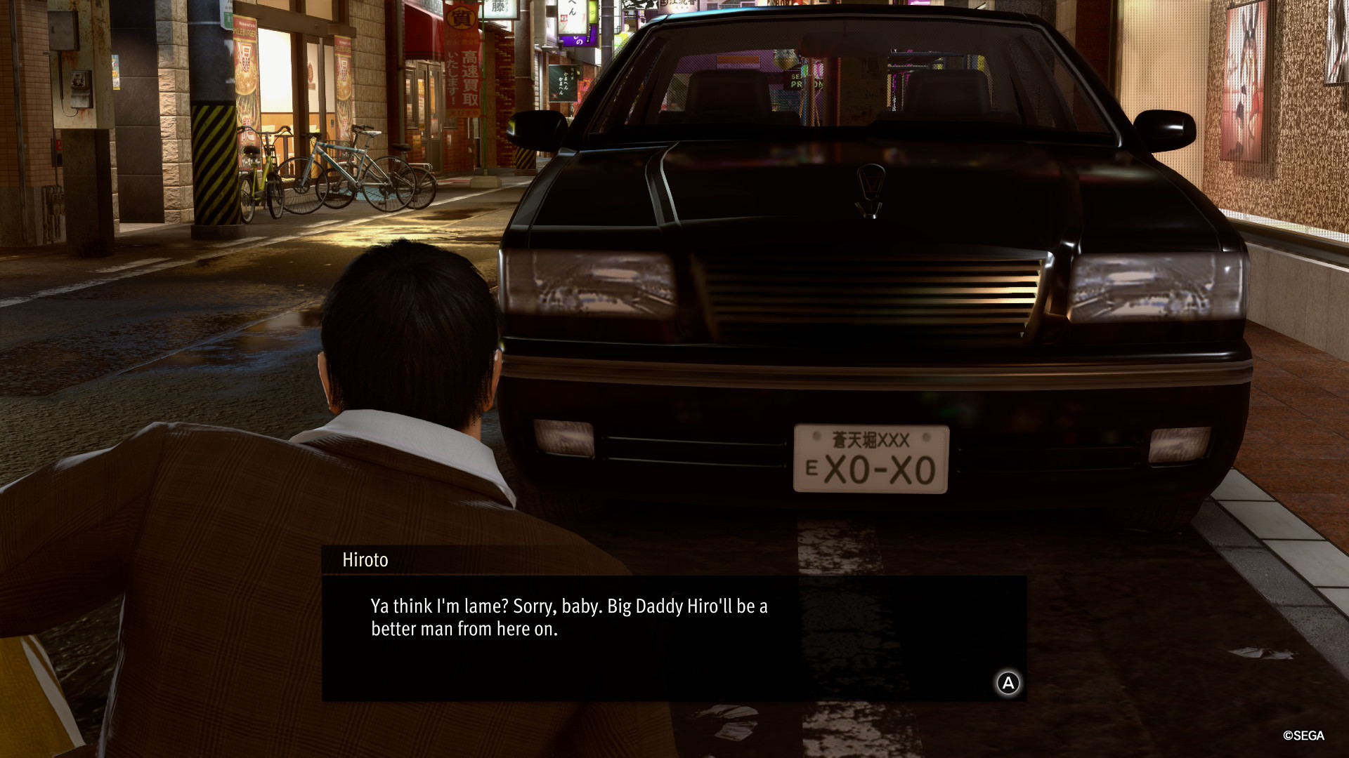 A man fawns over his car in Yakuza Kiwami 2